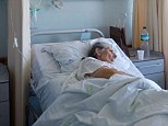 Elderly woman lying on her bed in an hospital ward