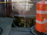 An overweight woman ended up in the basement of a New York restaurant after the sidewalk collapsed beneath her