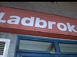Robbery: Customers disarmed the masked gun man when he stormed the Ladbrokes branch in Plymouth, Devon