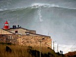 Monster wave: Garrett McNamara is said to have broken his own world record for the largest wave ever surfed when he rode this 100ft crest in Nazare, Portugal