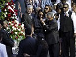 Sherra Wright, the ex-wife of slain NBA basketball player Lorenzen Wright, grieves at the casket of Wright during a memorial service at the FedExForum in Memphis, Tennessee, in August 2010