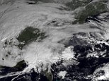 This image made available by NOAA shows the mammoth storm systems barreling over and towards the eastern half of the United States on Thursday