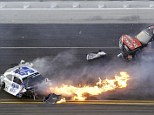 Fireball: Kyle Larson, left, slides to a stop near Regan Smith (7) after a wreck at the conclusion of the NASCAR Nationwide Series auto race