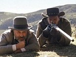 Django, right, played by Jamie Foxx is purchased and freed by bounty hunter Dr King Schultz, left, played by Christoph Waltz