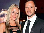 Vigil: Oscar Pistorius (right) and his girlfriend Reeva Steenkamp (left) together in Johannesburg, South Africa, on February 7. The athlete was due to hold a private memorial service to her