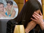 Struggling: Jodi Arias, pictured on the stand on Thursday, lost her composure when she was forced by the prosecution to look at naked pictures of Travis Alexander's body in the shower moments before he died on June 4, 2008 
