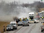 Fiery crash: Emergency personnel work at the scene of a multi-vehicle wreck on Interstate 65 near the 82 mile marker, which killed six members of the same family 