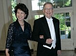 Power couple: Senator Mitch McConnell, right, defended his wife, Elaine Chao, left, following a racially charged attack by a liberal super PAC
