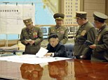 War bunker: North Korean leader Kim Jong-un presides over an urgent operation meeting with his generals after the country put its rocket units on standby to attack U.S. military bases in South Korea and the Pacific