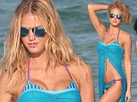 Doing what she does best! Victoria's Secret Angel Erin Heatherton poses up a storm on a beach bikini photoshoot 