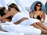 Get a room! Bikini-clad Claudia Galanti gets amorous under a beach towel with her billionaire boyfriend 