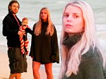 Sunrise stroll: Jessica Simpson and Eric Johnson enjoyed an early morning beach walk with their daughter Maxwell on Christmas Eve