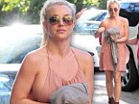 Oops! Britney Spears shows some side boob action in pink halter dress... as she narrowly misses wardrobe malfunction