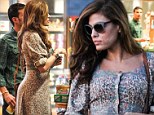 Looks can be deceiving! Eva Mendes dresses in a floaty floral frock... but still manages to shows off her sexy curves 