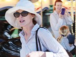 Marcia Cross treats her daughter Savannah to a carousel ride on their day out at the beach
