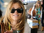  The 25-year-old 90210 star went make-up free as she jetted in to the airport from Utah where she has been hosting 'Catdance' at the Sundance Film Festival.