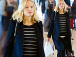 Pregnant Malin Akerman can't hide that growing bump... as she jets to Los Angeles in black coat and striped jumper