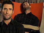That's one way to get through to the next round! SNL cast member drugs and ties Voice host Adam Levine to his swivel chair in parody promo
