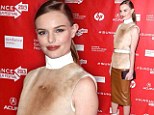 Mid-century mademoiselle: Kate Bosworth channels the '60s in bizarre 'calfskin' polo neck and white PVC boots 