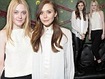 Very naughty girls! Sundance stars Dakota Fanning and Elizabeth Olsen stand on a couch to pose in co-ordinating monochrome outfits 