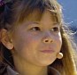 Bindi Irwin, the daughter of 'Crocodile Hunter' Steve Irwin, reads a speech for her father at a memorial service at Australia Zoo in Beerwah September 20, 2006