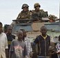 Military offensive: Timbuktu residents greet French troops as they enter the historic desert city