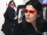 Rose-tinted view of the world: Outre Nigella Lawson adds a splash of colour to her look with red glasses as she grabs a bite to eat