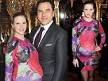 She really IS blooming: Lara Stone showcases her bump in rose-print dress as she joins David Walliams at party