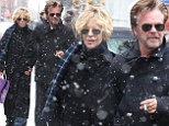 Let it snow! Meg Ryan and beau John Mellencamp cuddle up during a wintry day of shopping