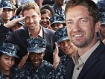 Pirate: Gerard Butler pretended to steer a navy ship at Camp Pendleton in San Diego, California, on Saturday