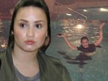Demi Lovato tweets picture of her enjoying a swim in full make-up... but proves the barely there look works just as well for her