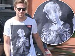 Home Alone fan? Ryan Gosling shows off his impressive biceps in Macauley Culkin T-shirt while pumping gas