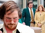 Master chameleon: Batman star Christian Bale was snapped sporting a combover and a paunch on set of his new film with Amy Adams on Thursday in Natick, Massachusetts 