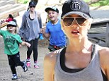Left in the dust! Gwen Stefani lags behind her two energetic sons as they race ahead during family hike together 