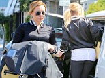 Varsity girl! Hilary Duff jazzes up her workout attire with a bomber jacket and shows off her slimmer size in tight leggings 