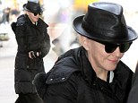 Madonna was swamped in layers of black, including a leather fedora and a heavy fur-lined puffer coat, in New York City on Saturday