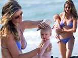 How precious! Bikini-clad Gisele Bundchen dotes over baby Vivien as she displays her perfect post-pregnancy curves on the beach in Costa Rica 