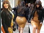 Still in Spanx! Kim Kardashian gives a glimpse of her girdle as she squeezes her pregnancy curves into a VERY tight leather shift dress