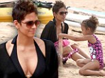 Halle Berry hides her famous curves as she hits the beach with fiance Olivier Martinez and daughter Nahla in Hawaii