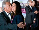 More in love than ever! Dustin Hoffman showers his wife of 32 years with kisses at Paris première