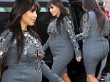 'I'm not ashamed of my body': Kim Kardashian proudly displays her pregnancy curves in bejewelled figure-hugging dress 