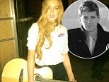 Lindsay Lohan tweeted a picture of herself with a guitar at the City Of The Sun gig featuring boyfriend Avi Snow
