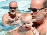 She's his little water baby: Kelsey Grammer kisses his little girl Faith as they enjoy a dip in the pool in Miami