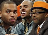 Guy's night! Chris Brown watches the Knicks game with Spike Lee after rumoured split with Rihanna