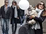 Adorable: Elisabetta Canalis and Marcus Kowal were clearly besotted with a little pooch on a street corner in Milan, on Saturday