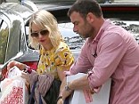 Naomi Watts and her partner Liev Schreiber struggle under the weight of Easter goodies as they arrive at friend's house for lunch on Sunday