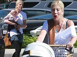 Slimmed-down Tori Spelling steps out in denim shorts... but hides her pins under a layer of leggings