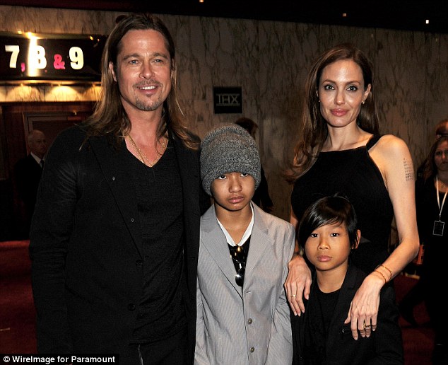 Divorcing: Brad Pitt and Angelina Jolie with two of their six children. She has filed for divorce