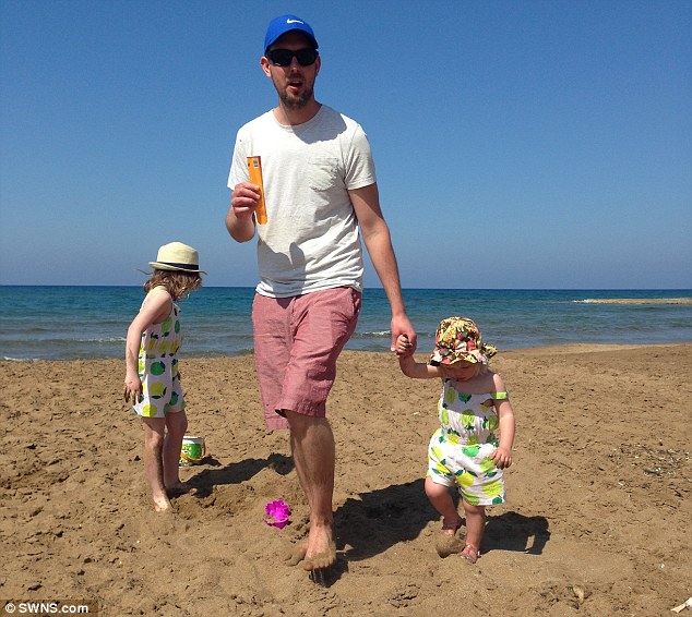 Mr Wernham, pictured on holiday with Iris, right, and Olivia, left, needs wheelchair access to be built at his home while the family needs to a hire a live-in carer