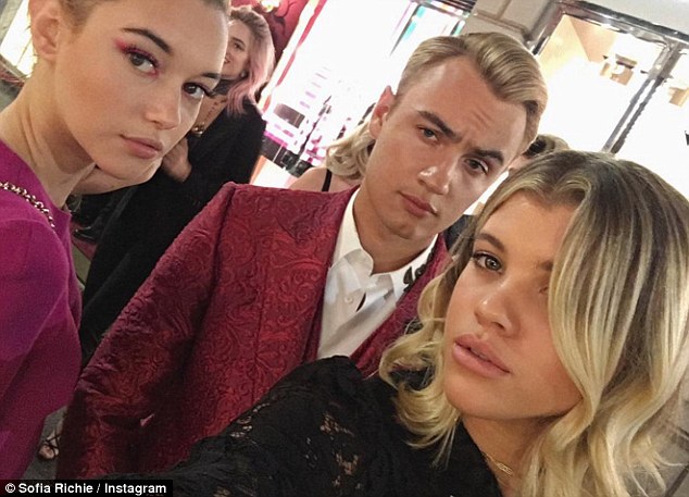 In good company! Richie has been attending various fashion week events and sightseeing with Pamela Anderson's son, Brandon Thomas Lee, 20, pictured Sunday
